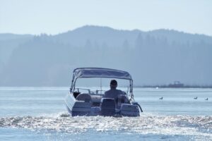 man driving a boat